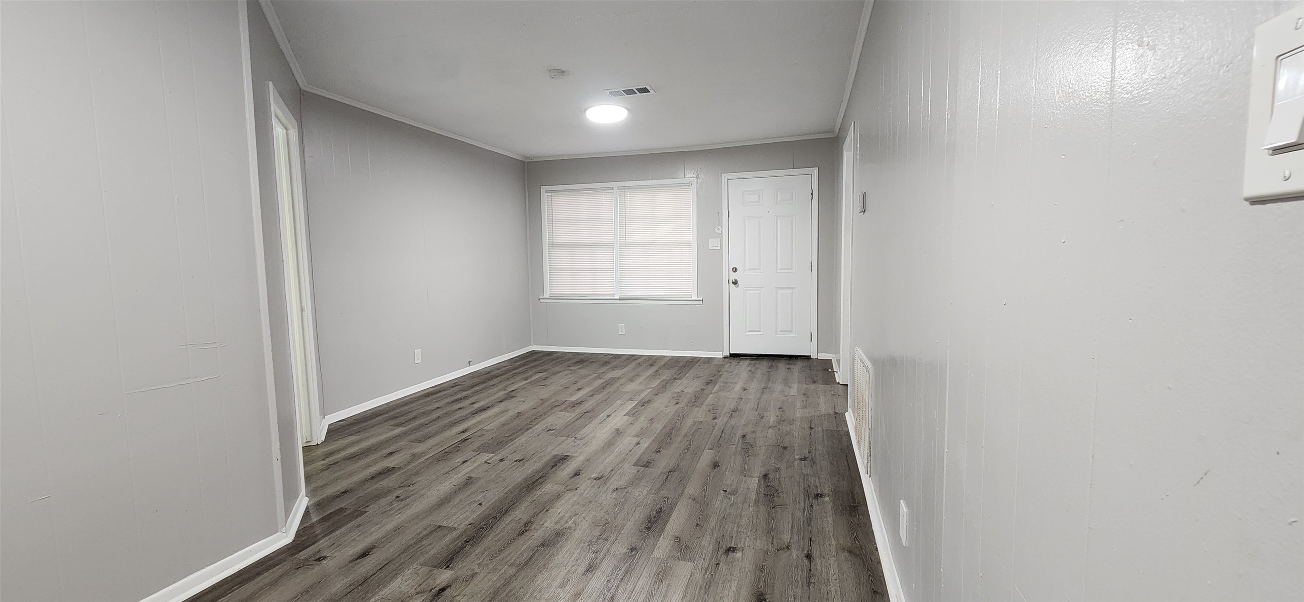 128 Huisache Street Lake Jackson, TX 77566 - Photo 6 of 23 a view of a room with wooden floor and bench