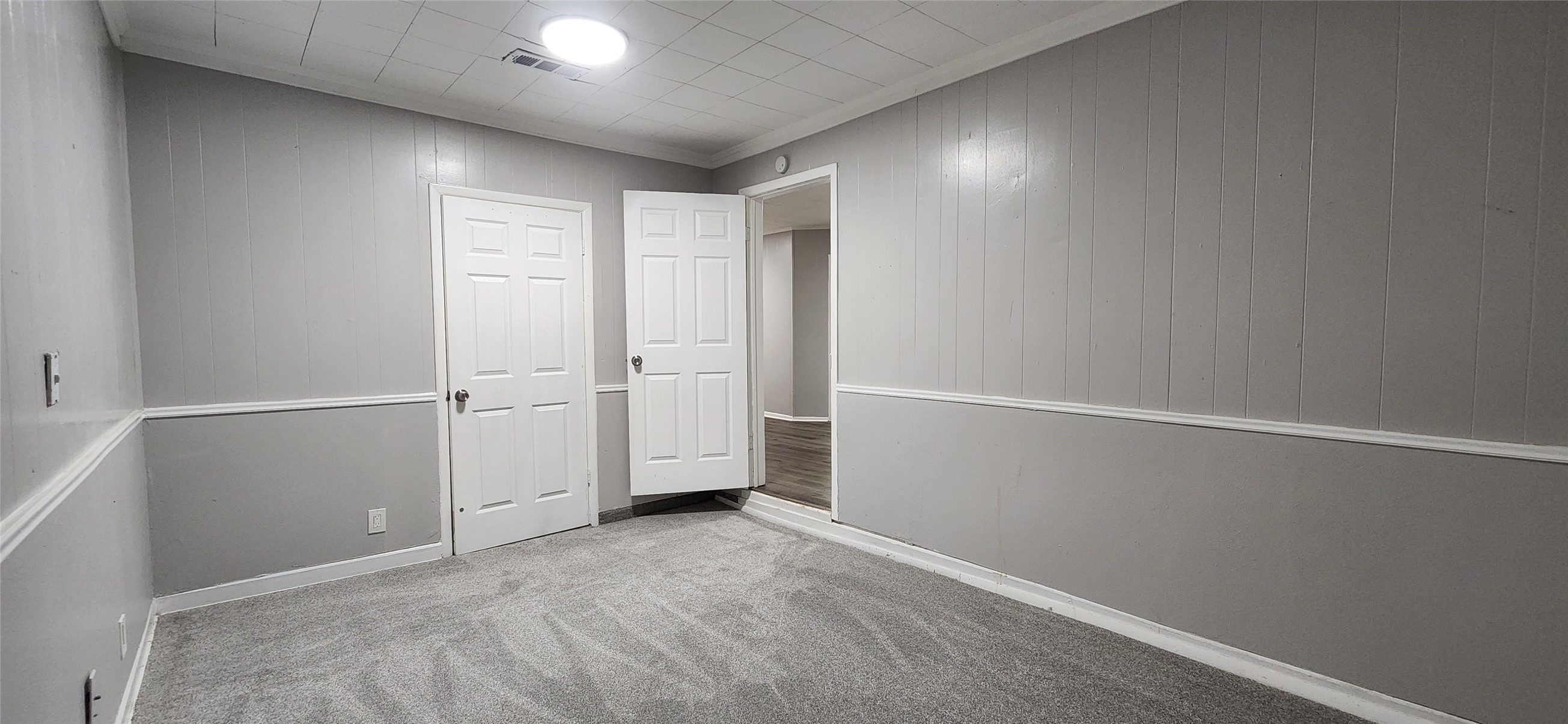 128 Huisache Street Lake Jackson, TX 77566 - Photo 8 of 23 an empty room with windows