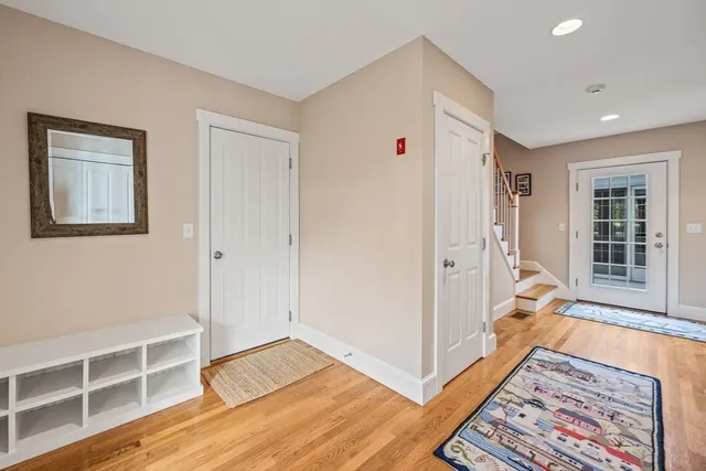 a aerial view of a house with a big yard and large trees