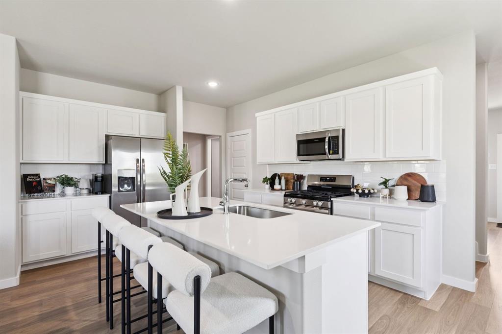 140 Millwood Road Lavon, TX 75166 - Photo 5 of 28 Kitchen in the Magnolia home plan by Trophy Signature Homes – REPRESENTATIVE PHOTO