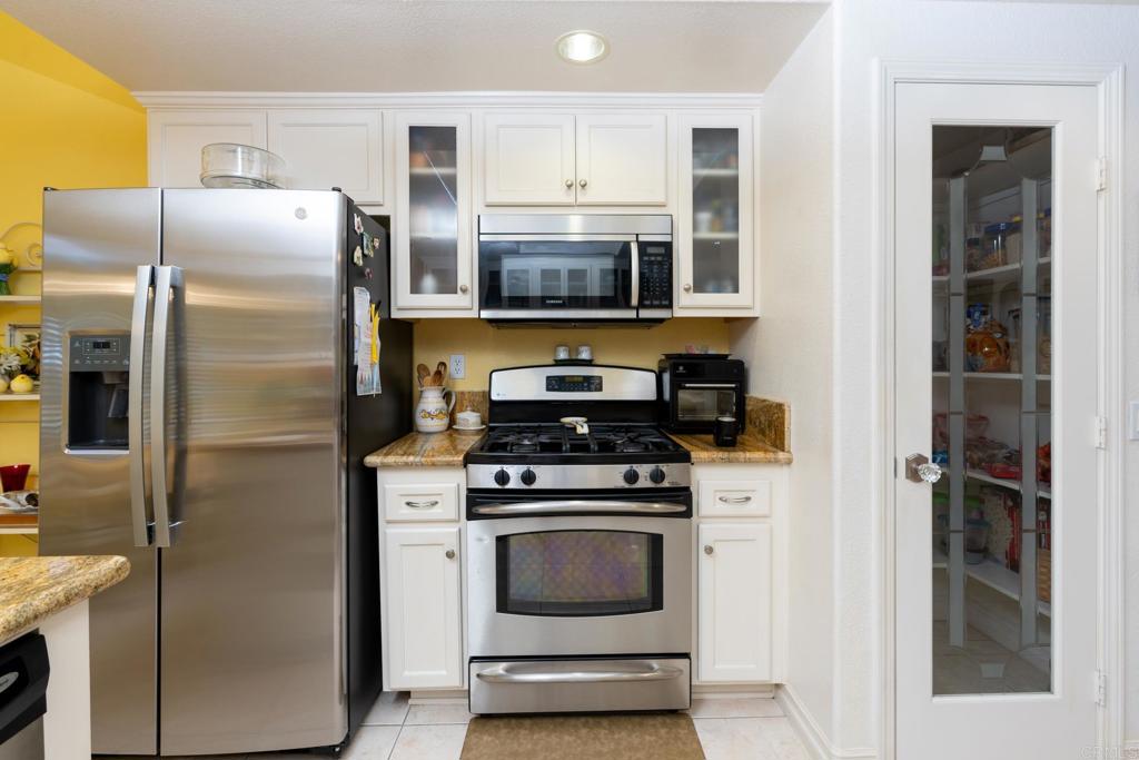 2807 Manzanita View Road Alpine, CA 91901 - Photo 14 of 36 a kitchen with stainless steel appliances granite countertop a refrigerator stove and microwave
