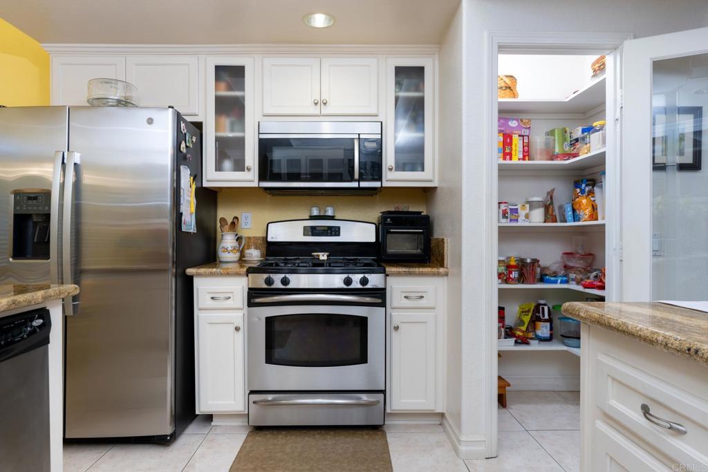2807 Manzanita View Road Alpine, CA 91901 - Photo 15 of 36 a kitchen with cabinets and stainless steel appliances