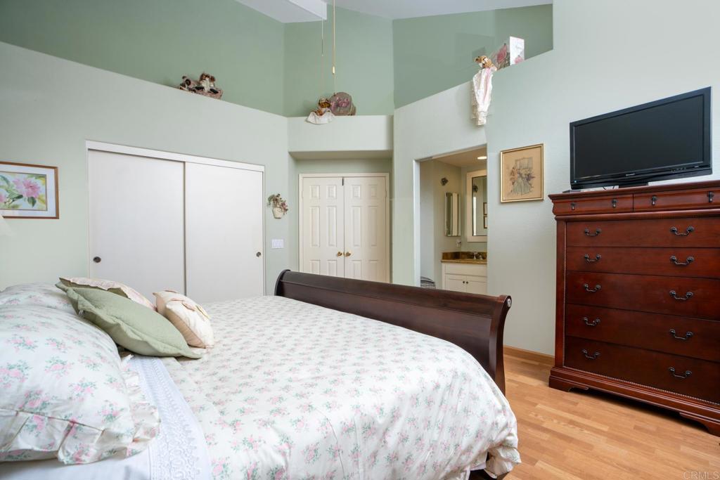 2807 Manzanita View Road Alpine, CA 91901 - Photo 20 of 36 a bedroom with a bed and a flat tv screen on dresser