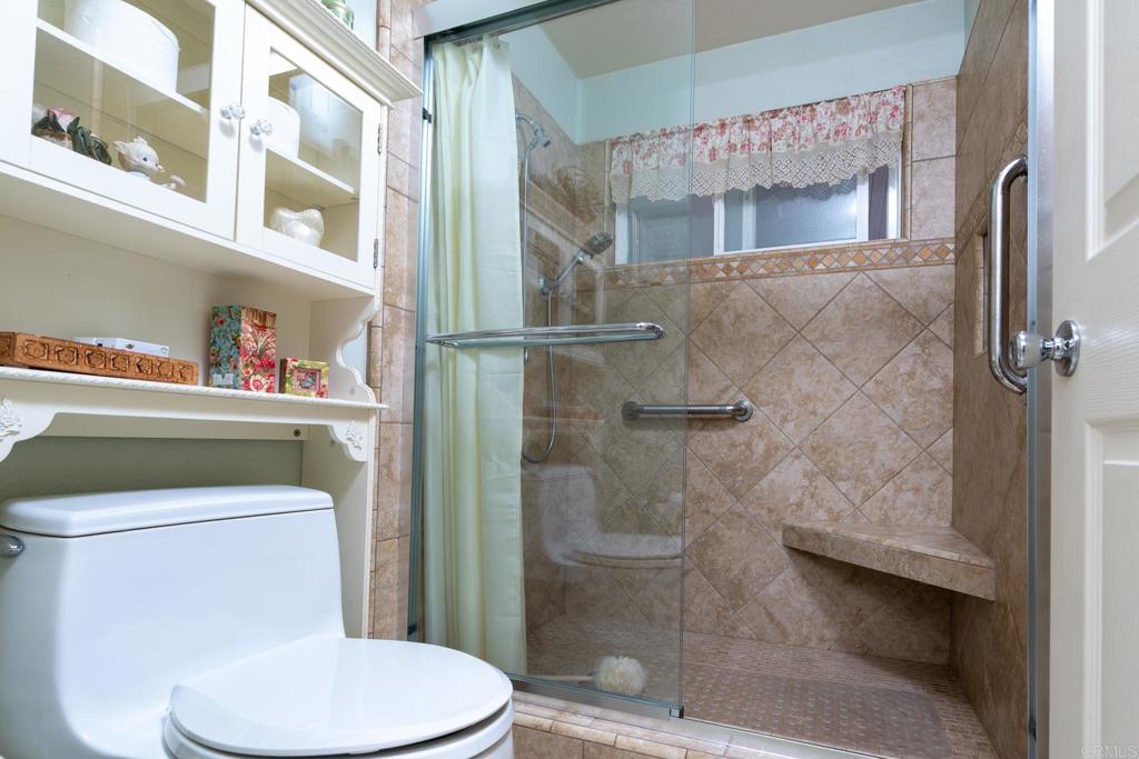 2807 Manzanita View Road Alpine, CA 91901 - Photo 22 of 36 a white toilet sitting next to a bathroom sink