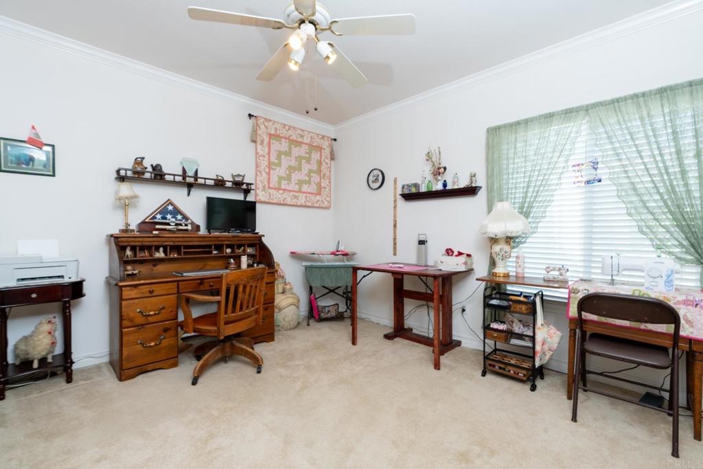 2807 Manzanita View Road Alpine, CA 91901 - Photo 23 of 36 a view of a workspace with furniture and a window