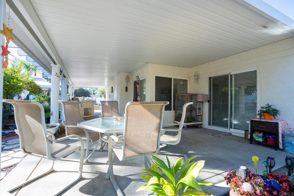 2807 Manzanita View Road Alpine, CA 91901 - Photo 30 of 36 a dining room with furniture and a floor to ceiling window