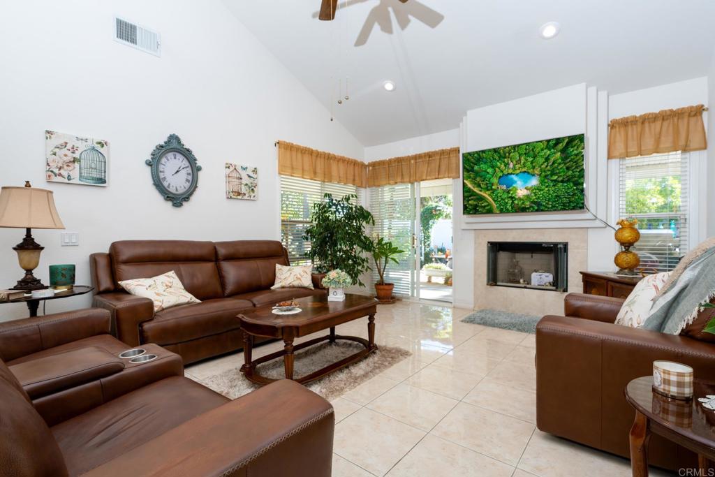 2807 Manzanita View Road Alpine, CA 91901 - Photo 6 of 36 a living room with furniture a fireplace and a flat screen tv