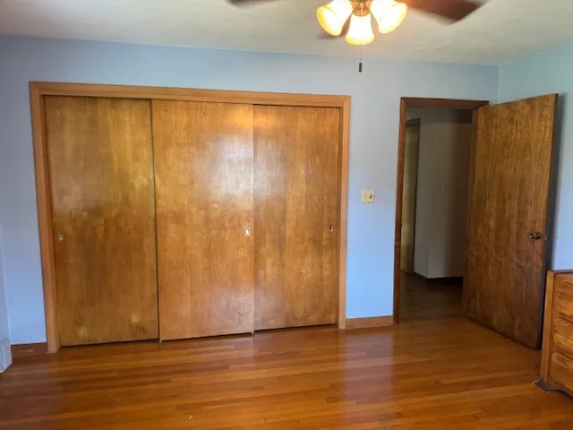a view of entryway with wooden floor and door