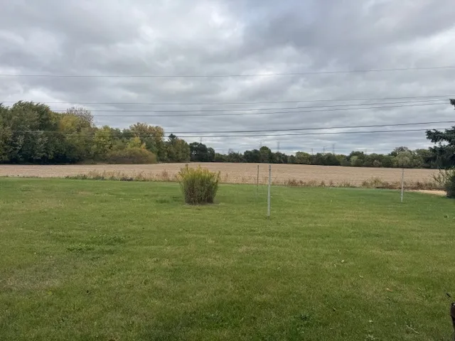 a view of a lake with houses in the back