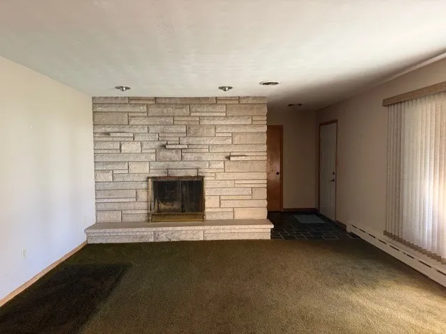 an empty room with fireplace