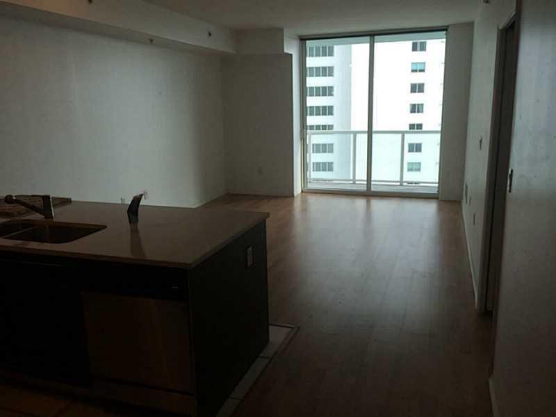 1900 North Bayshore Drive, Unit 2609 Miami, FL 33132 - Photo 11 of 36 a view of a livingroom with wooden floor and a window