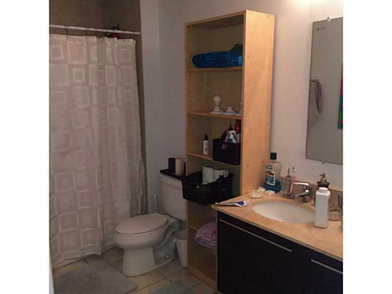 1900 North Bayshore Drive, Unit 2609 Miami, FL 33132 - Photo 12 of 36 a bathroom with a sink toilet and shower