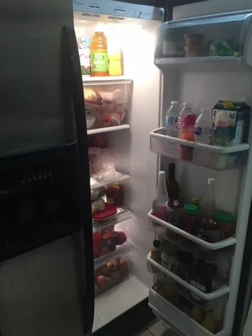 a kitchen with a refrigerator stove and microwave