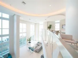 a large kitchen with a table and chairs