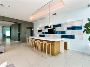 1900 North Bayshore Drive, Unit 2609 Miami, FL 33132 - Photo 27 of 36 a large kitchen with a table and chairs