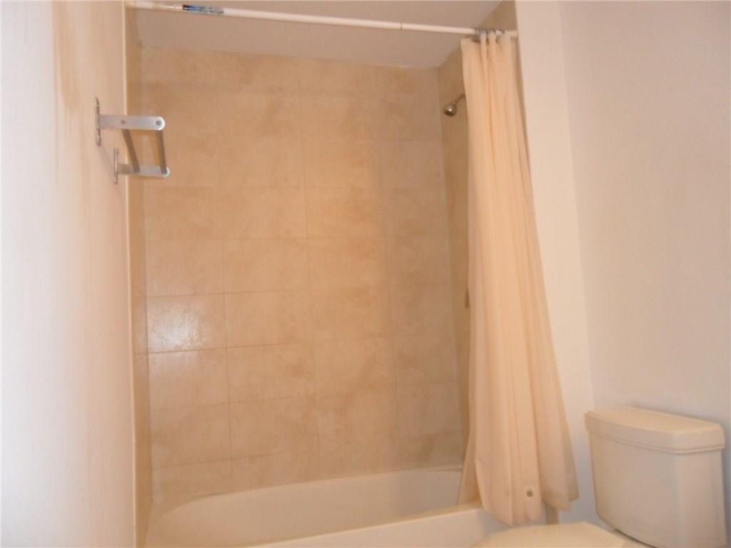 1900 North Bayshore Drive, Unit 2609 Miami, FL 33132 - Photo 30 of 36 a bathroom with a shower and a toilet