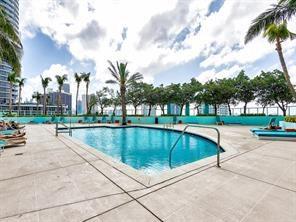 1900 North Bayshore Drive, Unit 2609 Miami, FL 33132 - Photo 9 of 36 a view of swimming pool with outdoor seating and plants