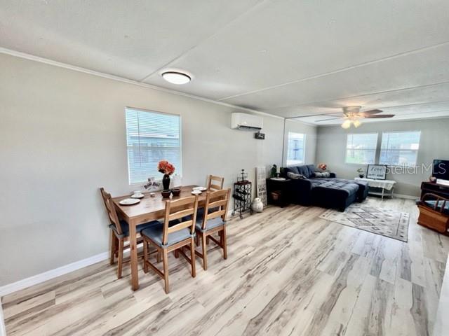 10826 Tioga Drive Port Richey, FL 34668 - Photo 18 of 59 a living room with furniture a window and a table