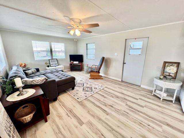 10826 Tioga Drive Port Richey, FL 34668 - Photo 21 of 59 a bedroom with furniture and a wooden floor