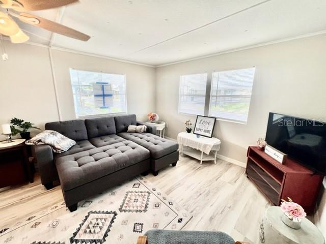 10826 Tioga Drive Port Richey, FL 34668 - Photo 22 of 59 a living room with furniture and a couch