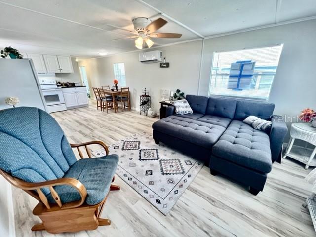 10826 Tioga Drive Port Richey, FL 34668 - Photo 26 of 59 a living room with furniture