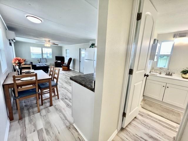 10826 Tioga Drive Port Richey, FL 34668 - Photo 27 of 59 a very nice looking room with wooden floor and furniture