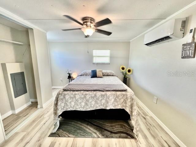 10826 Tioga Drive Port Richey, FL 34668 - Photo 34 of 59 a bedroom with a bed and a mirror