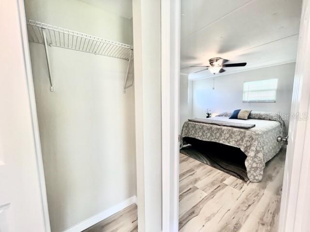 10826 Tioga Drive Port Richey, FL 34668 - Photo 35 of 59 a bedroom with a bed and a window