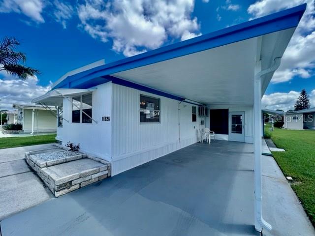 10826 Tioga Drive Port Richey, FL 34668 - Photo 4 of 59 a view of a porch in front of house
