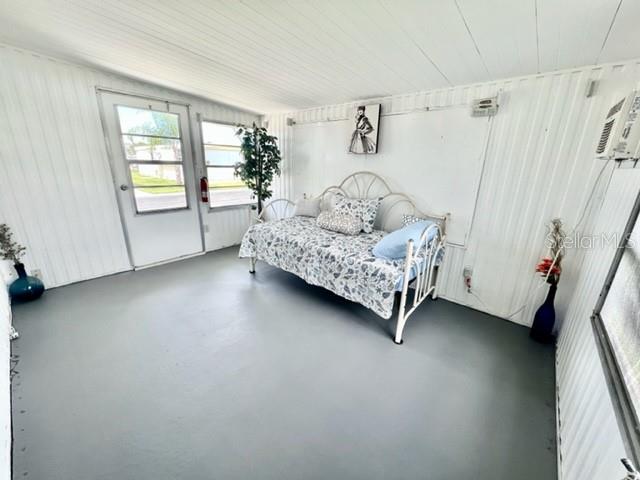 10826 Tioga Drive Port Richey, FL 34668 - Photo 41 of 59 a spacious bedroom with a bed and a window