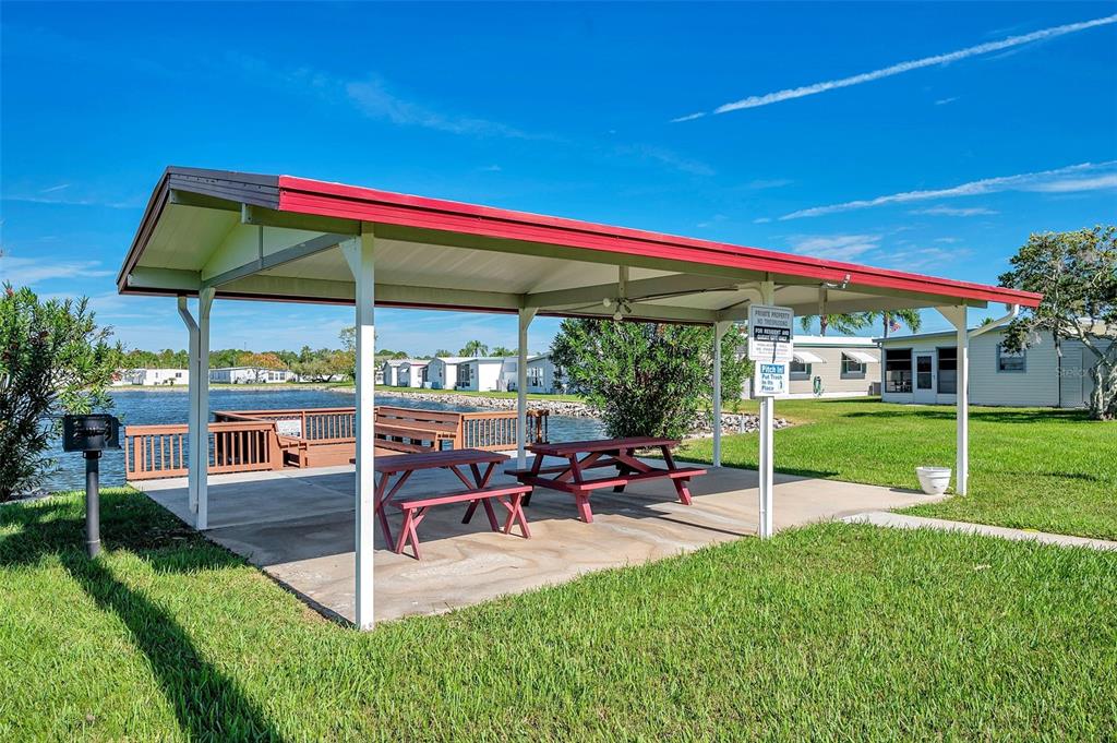 10826 Tioga Drive Port Richey, FL 34668 - Photo 55 of 59 a view of a house with backyard and sitting area