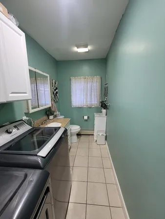 a kitchen with a sink and a stove top oven