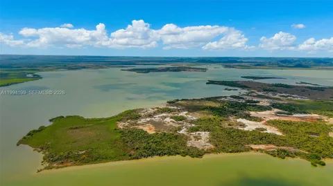 a view of a lake in between of two of trees
