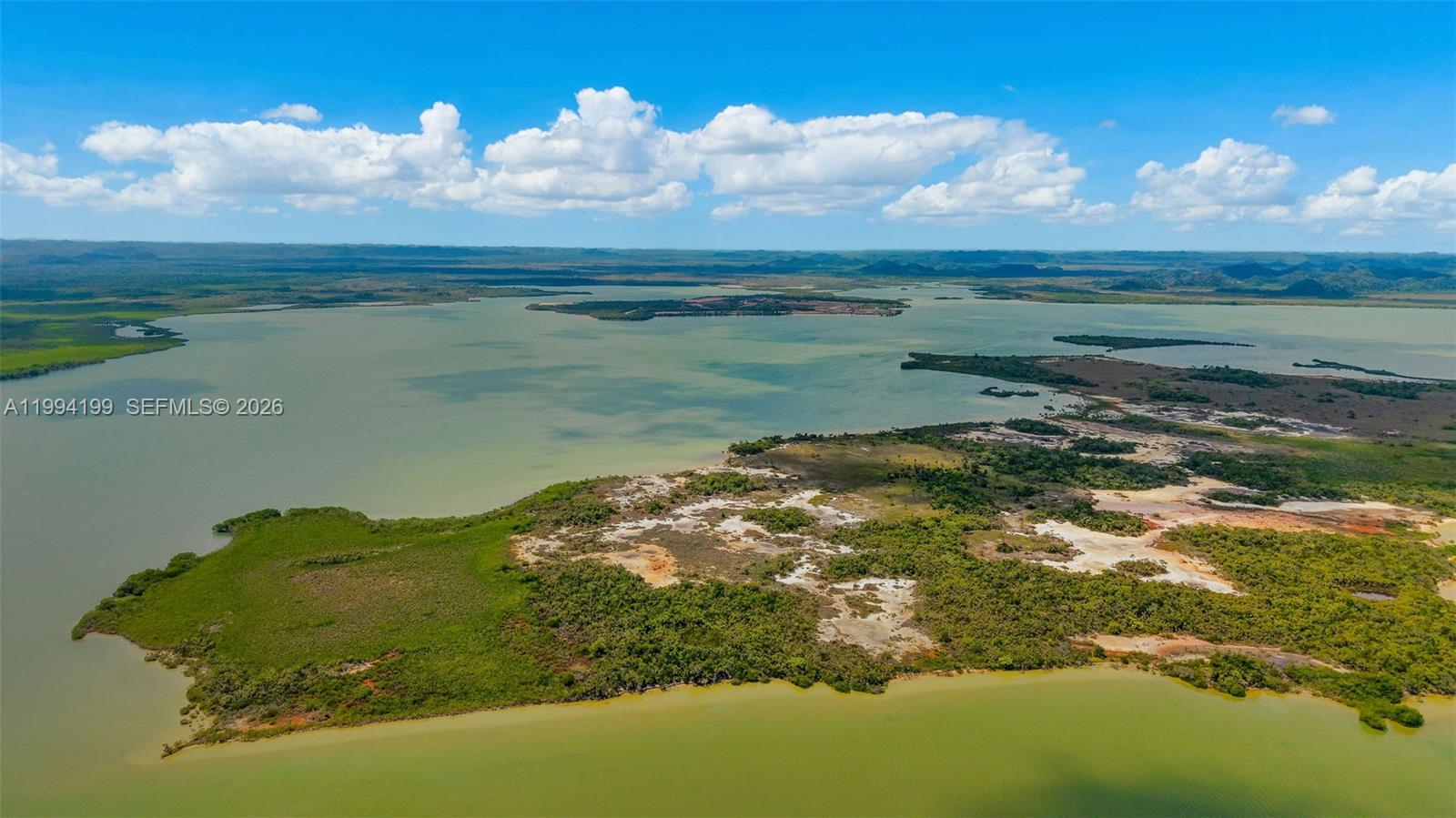 Tiger Point Tiger Point undefined, undefined 00000 - Photo 6 of 18 a view of a lake in between of two of trees