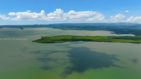 a view of a golf course with a lake