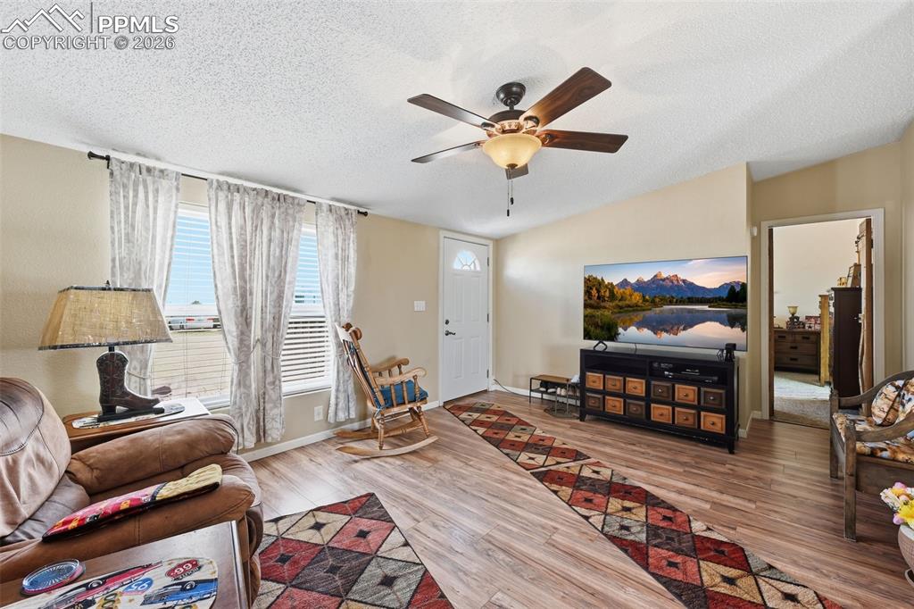 20985 McDaniels Road Calhan, CO 80808 - Photo 20 of 41 a bedroom with furniture and a wooden floor