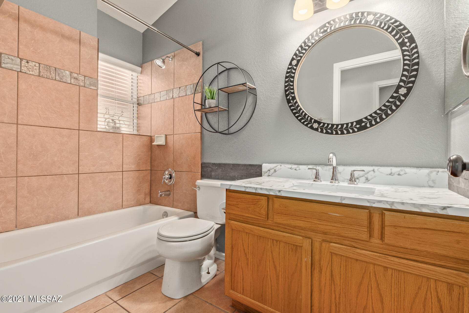 3034 West Sky Ranch Trail Tucson, AZ 85742 - Photo 21 of 27 a bathroom with a toilet a sink and a mirror
