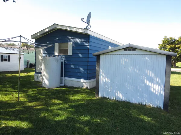 a front view of house with a garden