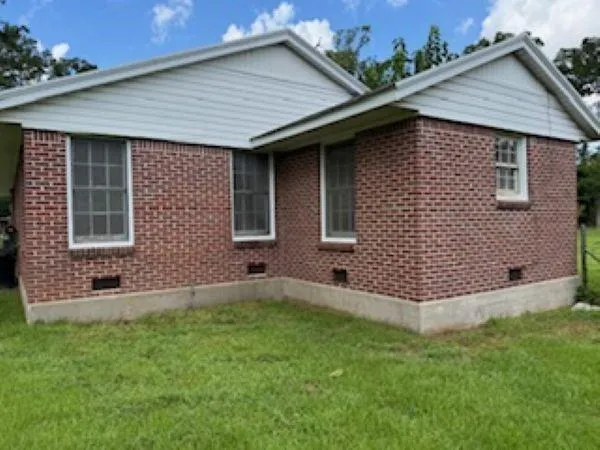 a backyard of a house with lots of green space