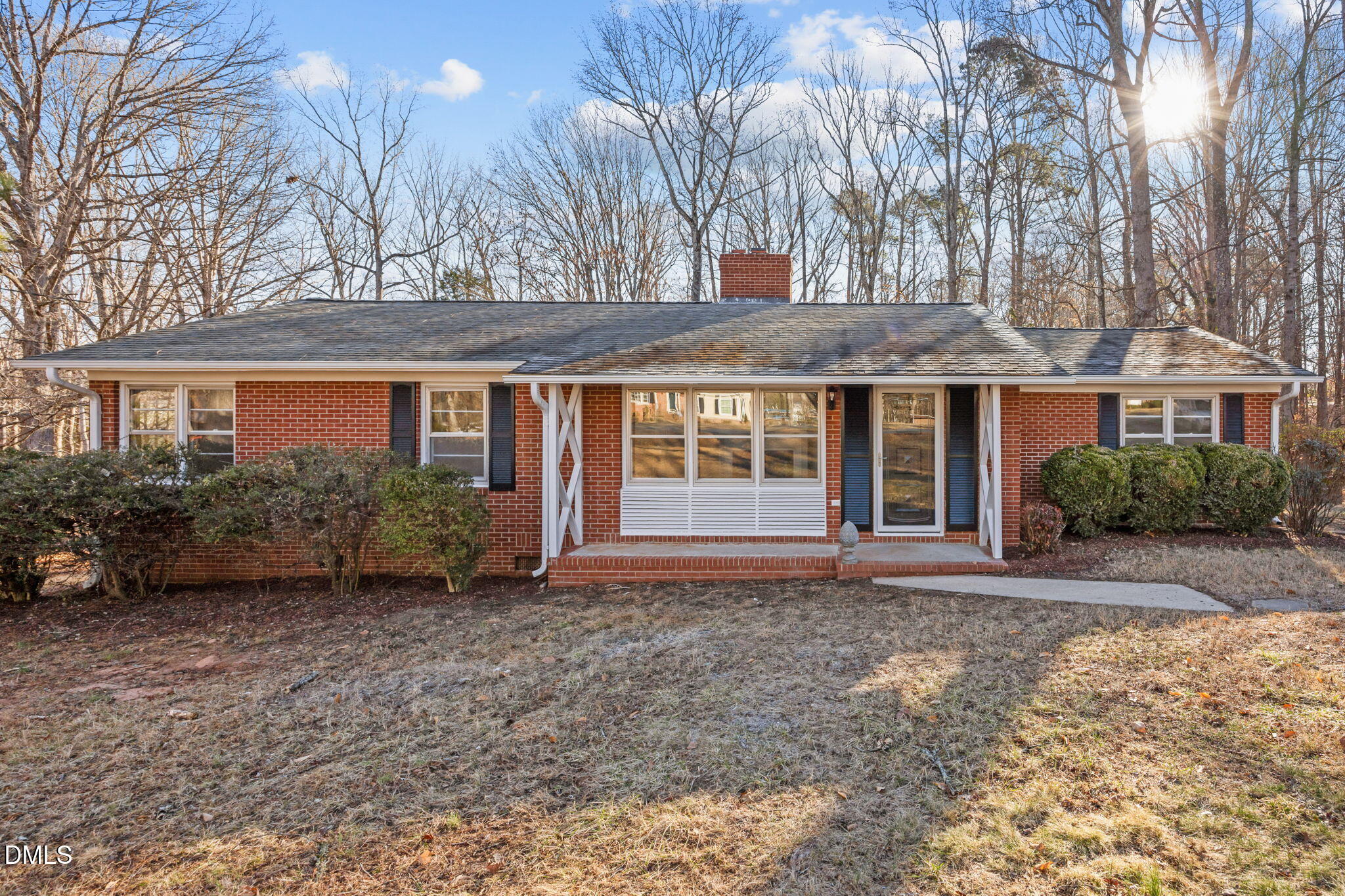 122 Ridgecrest Drive Warrenton, NC 27589 - Photo 1 of 48 a front view of a house with garden