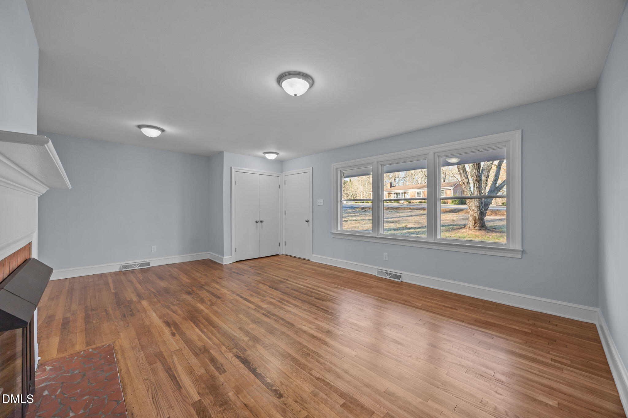 122 Ridgecrest Drive Warrenton, NC 27589 - Photo 26 of 48 a view of an empty room with wooden floor and a window