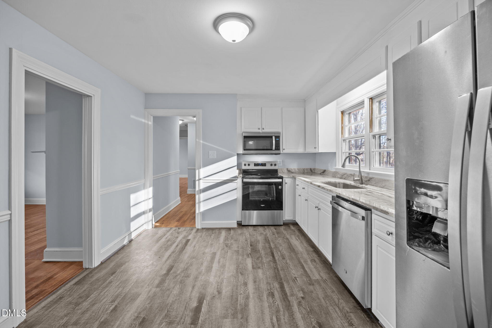 122 Ridgecrest Drive Warrenton, NC 27589 - Photo 30 of 48 a kitchen with stainless steel appliances a refrigerator sink and cabinets