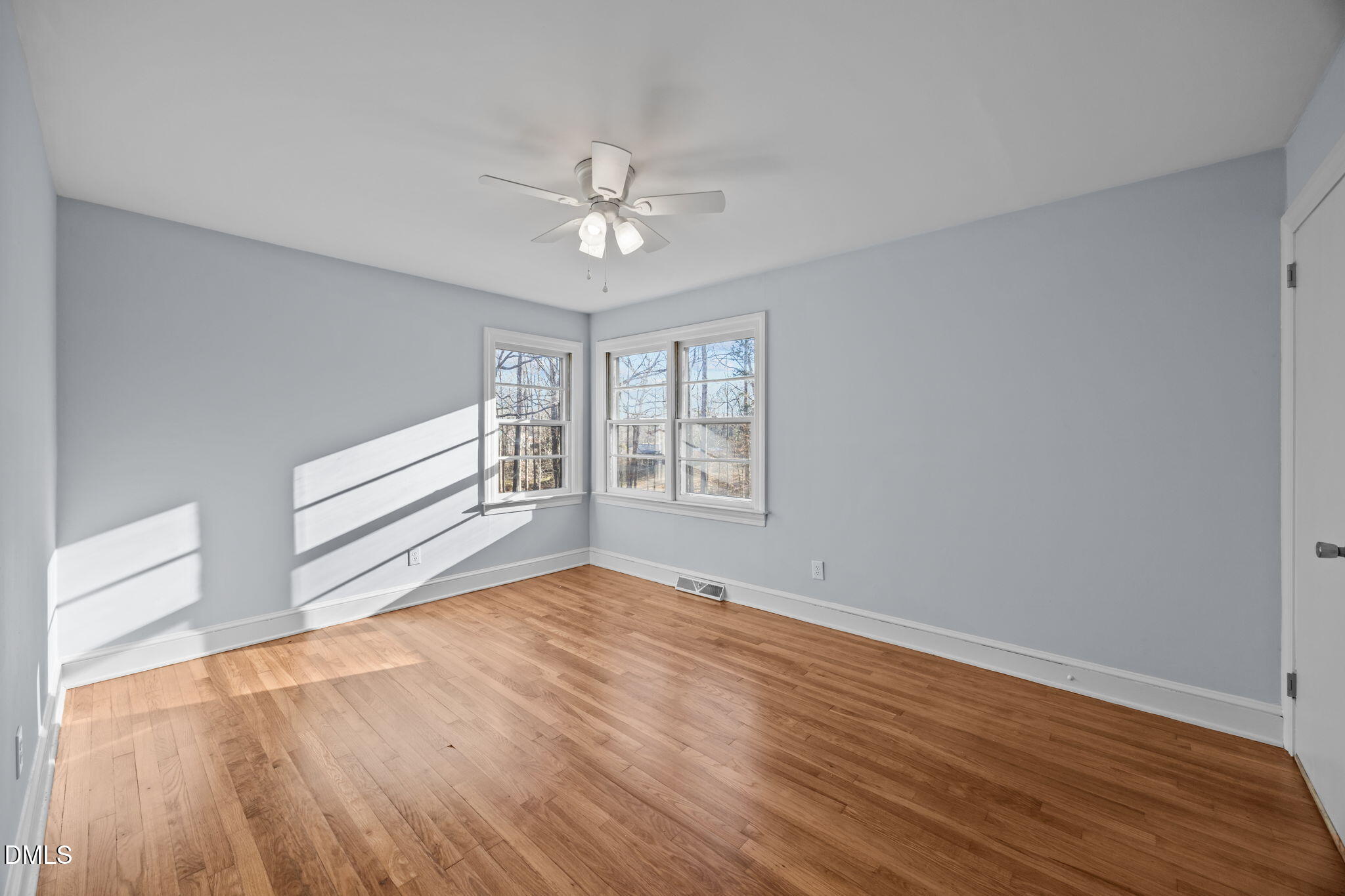 122 Ridgecrest Drive Warrenton, NC 27589 - Photo 31 of 48 a view of an empty room with wooden floor and a window