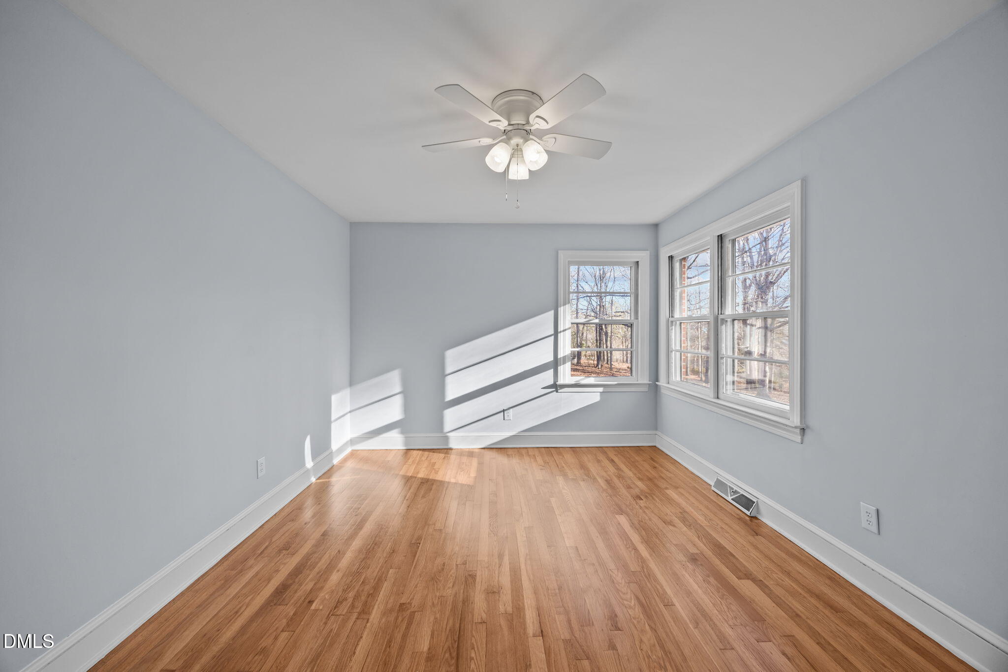 122 Ridgecrest Drive Warrenton, NC 27589 - Photo 33 of 48 a view of an empty room with wooden floor and a window