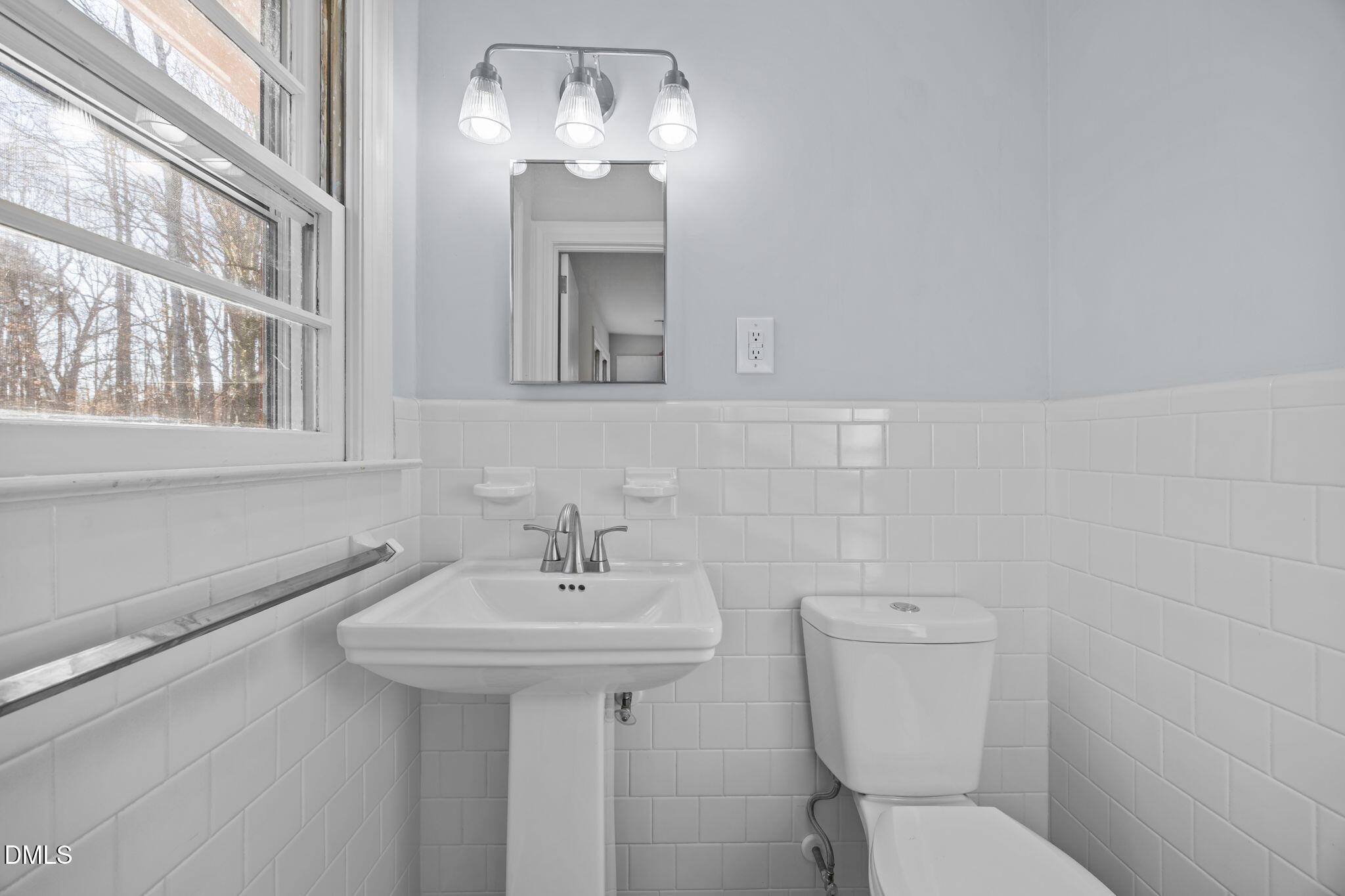 122 Ridgecrest Drive Warrenton, NC 27589 - Photo 34 of 48 a bathroom with a toilet sink and mirror