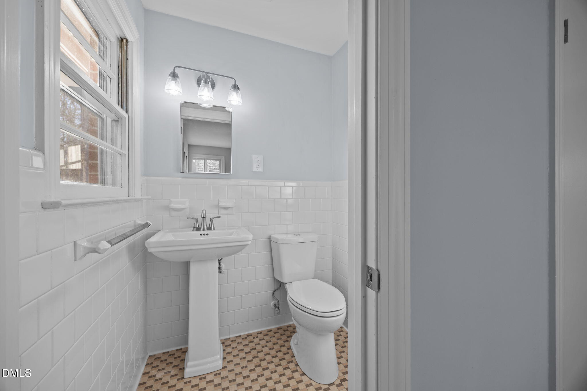 122 Ridgecrest Drive Warrenton, NC 27589 - Photo 35 of 48 a bathroom with a sink toilet and mirror