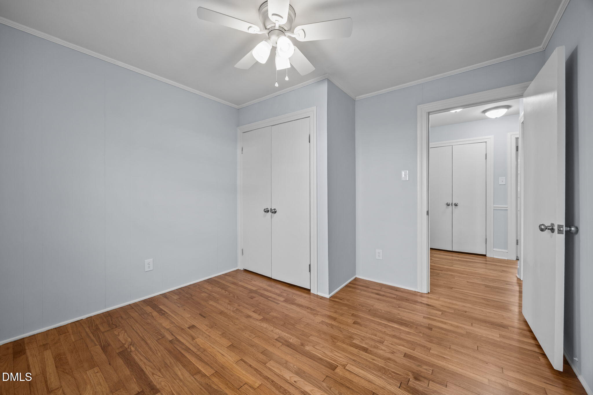 122 Ridgecrest Drive Warrenton, NC 27589 - Photo 39 of 48 a view of empty room with wooden floor and ceiling fan