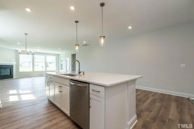 a kitchen with a sink and window