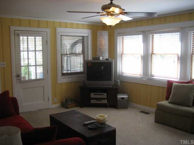 2709 Van Dyke Avenue Raleigh, NC 27607 - Photo 5 of 11 a living room with furniture and a flat screen tv