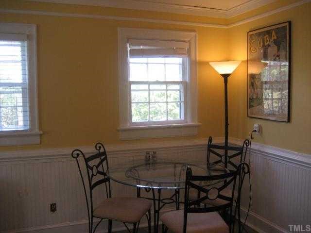 2709 Van Dyke Avenue Raleigh, NC 27607 - Photo 6 of 11 a view of a dining room with furniture and a window